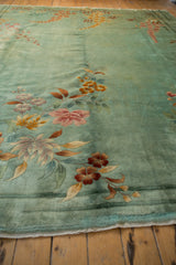 Seafoam green Nichols Art Deco rug, sprawling floral designs and original side cord selvage.
