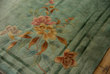 Blush and saffron floral bouquet and bamboo on seafoam green Nichols Art Deco carpet.