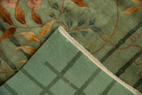 Chinese Nichols Art Deco rug showing seafoam green floral pile and tight grid-patterned reverse.