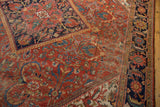 Vintage Persian Mahal rug: worn brick red field, sapphire blue Herati border, ivory motifs.