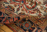 Vintage Mahal rug corner, highlighting navy field and Herati border's serrated leaves.