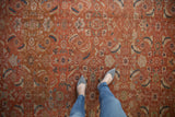 Vintage Mahal rug close-up: detailed Herati design with burnt orange, indigo blue, beige.