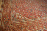 Vintage Persian Mahal carpet's finely detailed Herati pattern in burnt orange, indigo blue, and lime green.