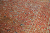 Intricate Herati design in burnt orange and sky blue on a vintage Persian Mahal rug.