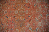 Detailed Herati motif with abrash color shifts in burnt orange, indigo, and beige.