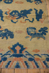 Antique Ningxia rug detail: cobalt blue Fu dog and apricot cloud motifs.