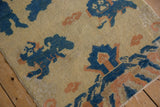 Antique Ningxia rug showing pictorial motif in cobalt blue, apricot, and cream with even pile wear.