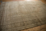 Vintage Distressed Oushak carpet with worn low pile and faded earth tone pattern.