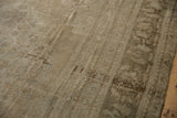 Textured vintage Oushak carpet with mostly even wear across to knot heads.