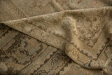 Distressed beige pile revealing knot heads, with woven foundation details of the vintage Oushak rug.