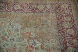 Distressed Mahal carpet detail with wear across knot heads, raspberry fuchsia and seafoam vinery.