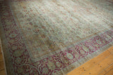 Distressed Persian Mahal carpet, pale seafoam green field, raspberry fuchsia scrolling border.