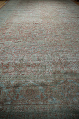 Faded Herati pattern and worn texture on vintage distressed Mahal carpet, dusty mauve and blue.