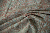Muted mauve, blue, ivory hues on distressed vintage Mahal carpet's folded texture.