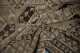 Vintage Ersari rug showcasing distressed pile with brown diamond patterns and floral guls.