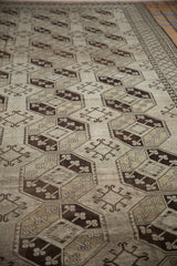 Distressed vintage Ersari geometric guls in chocolate brown, beige, and antique ivory tones.