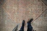 Distressed vintage Kamseh carpet pile, with faded geometric floral and animal motifs.