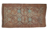 Vintage Distressed Belouch rug: geometric guls, serpent motifs, faded raspberry, brown, powder blue.