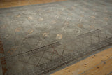 Distressed Ersari carpet runner showing silver, pale copper guls and geometric zig-zag border.