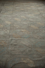 Distressed texture of the Ersari carpet runner, with muted silver, pale copper, and slate blue guls.