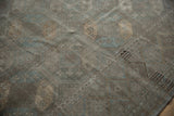 Vintage Ersari carpet detail: softened geometric guls in muted silver, slate blue, and copper tones.