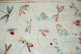 Variegated dragonfly pictorial motifs on a plain woven Kilim, featuring blues, pinks, and greens.