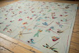 Close-up of the pictorial Kilim's plain weave texture with diverse, colorful dragonfly motifs.
