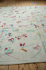 Varied, colorful dragonfly motifs on the plain woven Pakistani pictorial kilim.
