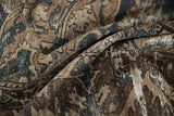 Distressed texture of vintage Bakhtiari carpet showing foundation, beige, brown, and faded blue.