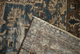 Distressed vintage Bakhtiari carpet pile and visible hand-knotted foundation.