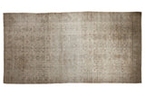 Distressed vintage Amritsar carpet with faded floral patterns in antique ivory, beige, and slate blue.
