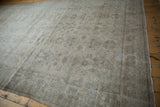 Distressed vintage Amritsar rug showcasing low pile, foundation, and faded floral palmette motifs.