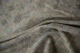 Distressed vintage Amritsar carpet detail, revealing woven foundation and muted heirloom colors.