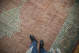 Distressed Vintage Mahal rug's worn copper-chestnut field and dusty sage green border underfoot.