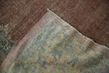 Distressed Mahal rug texture, showing wear to knot heads, woven foundation, and selvage.