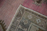 Reverse view of a vintage Kars runner showing the hand-knotted foundation and secured side cord.