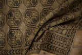 Distressed Afghani rug's geometric guls in dusty gold, coffee brown border, and fringed end.