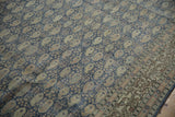 Distressed vintage Sivas rug, denim blue field with repeating boteh and ornate floral border.