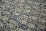 Distressed Sivas carpet: faded denim blue, sandalwood, and ivory boteh motifs with soft texture.