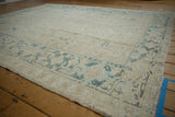 Vintage distressed Gorevan carpet side, highlighting faded geometric Samovar border in denim blue.