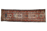 Antique Karaja runner, brick red field, geometric medallions, colorful border, showing wear, 3'3