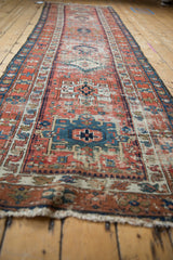 Antique Karaja runner's geometric medallions, pawn motif, and colorful vinery border.