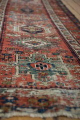 Hand-knotted texture of an antique Karaja runner, showcasing geometric pawn motifs and natural wear.