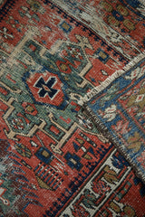 Intricate geometric patterns and checkered vinery border in brick red, indigo, celadon, and ivory.