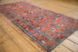 Vintage Borchalou runner's brick red field with stylized motifs and indigo blue dragon border.