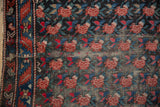 Antique Karabagh rug detail, madder root red rose motif, indigo leaves, thread bare foundation.