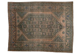 Vintage Distressed Shiraz carpet with oversized geometric medallion, dusty rose, blue, and charcoal.
