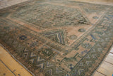 Distressed hand-knotted Shiraz rug border showing geometric chevron pattern and selvage.