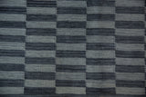 Hand woven Pakistani Kilim texture with alternating charcoal, slate, and silver rectangular elements.