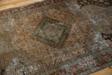 Vintage Distressed Malayer rug detail: worn pile with sandalwood, madder root rust, blue, and green.